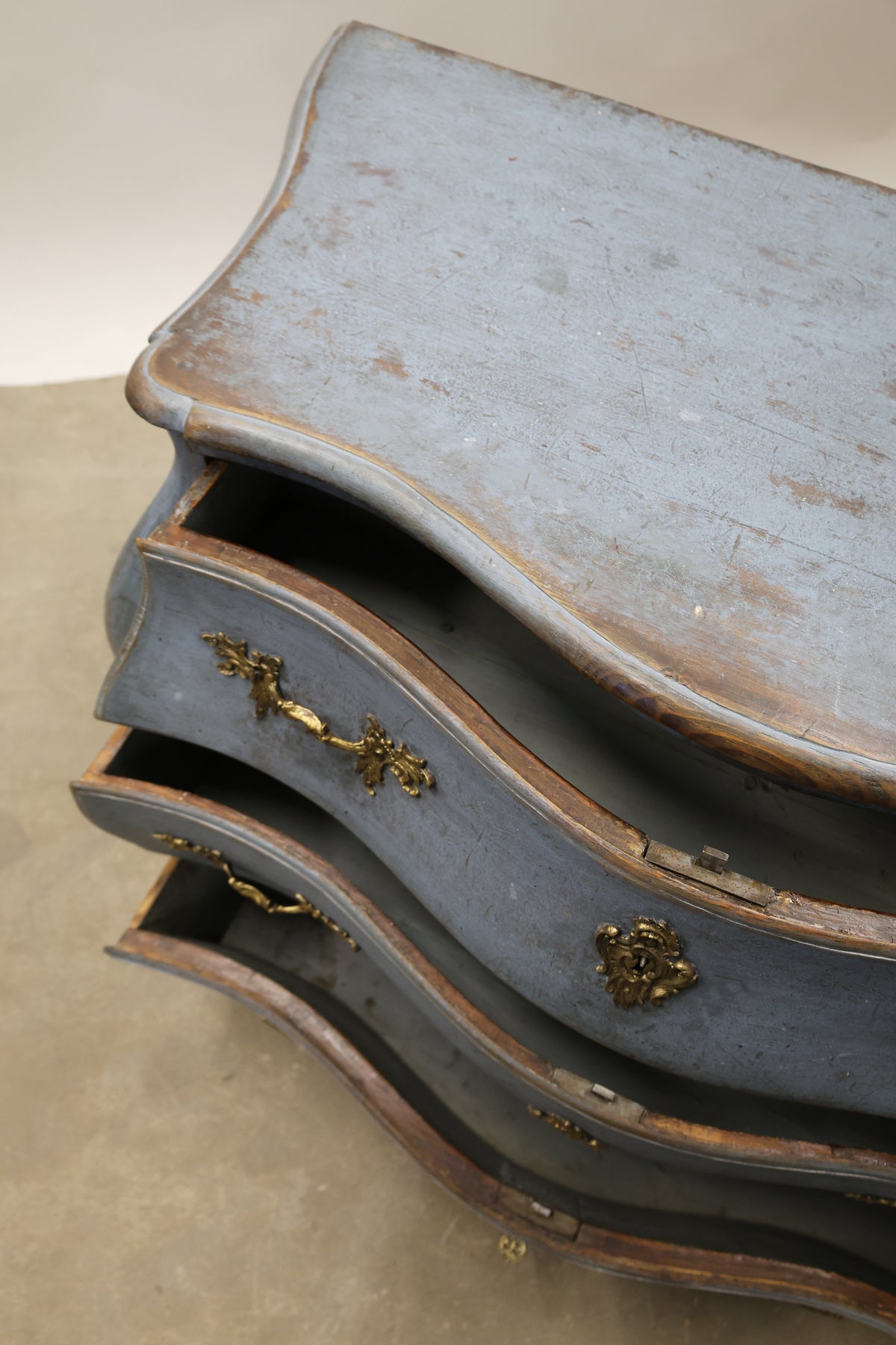 Opened drawers on a Rococo chest of drawers.