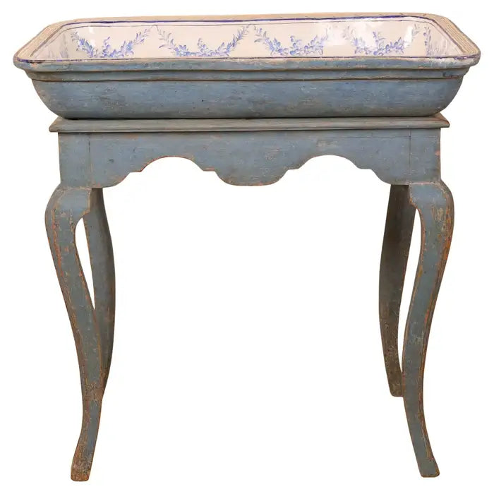 A beautiful tea table with a faience top, made in Stockholm during the Rococo period at the Marieberg faience factory. The decoration is chinoiserie in vibrant cobalt blue. The base retains its enhanced original blue color.