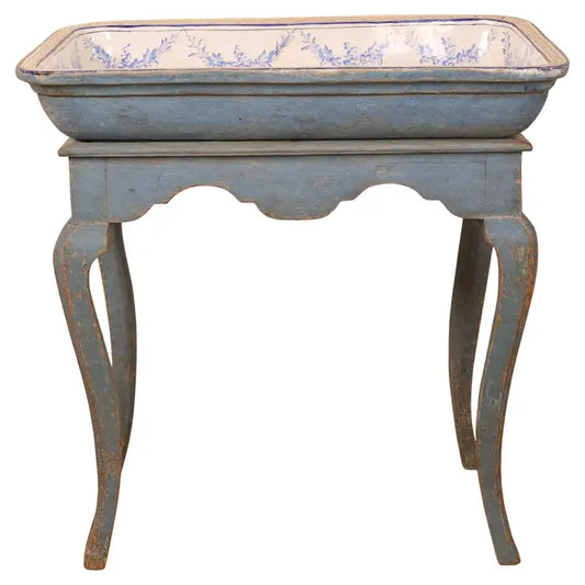 A beautiful tea table with a faience top, made in Stockholm during the Rococo period at the Marieberg faience factory. The decoration is chinoiserie in vibrant cobalt blue. The base retains its enhanced original blue color.