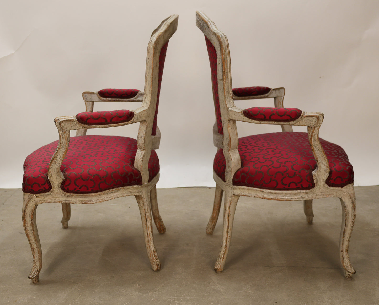Side view of a pair of Rococo armchairs.