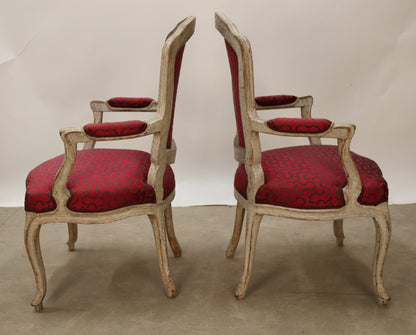 Side view of a pair of Rococo armchairs.