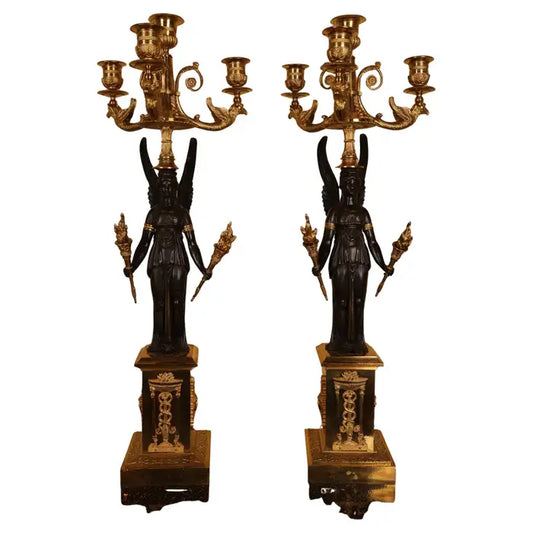 Antique candelabras with angels holding torches