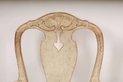 A close up of an 18th century Rococo armchair.