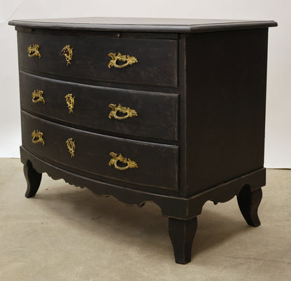 Black antique Baroque chest of drawers.
