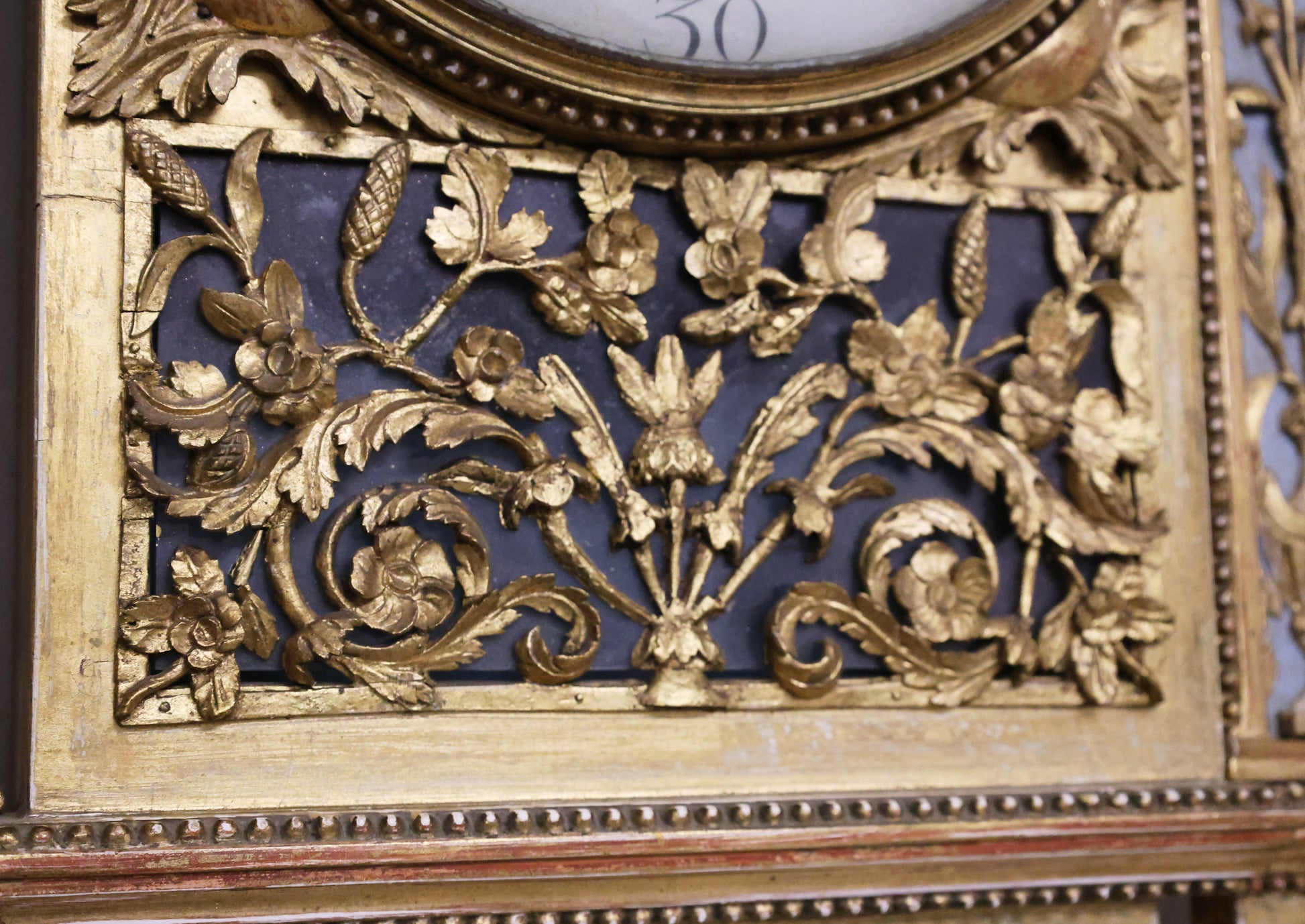 Detail overview of an antique wall clock from the Gustavian epoch.