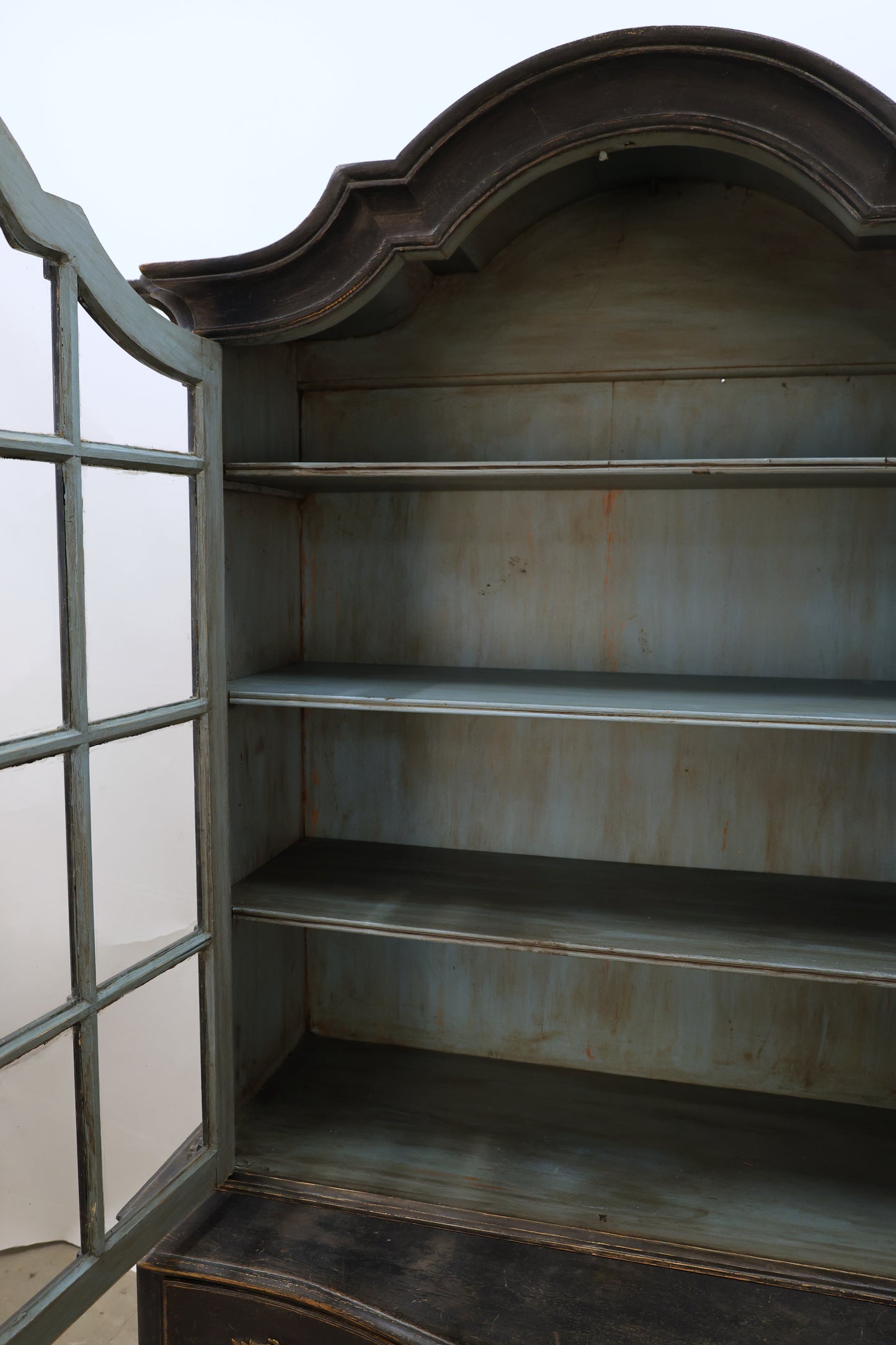Shelves in a Rococo display cabinet.
