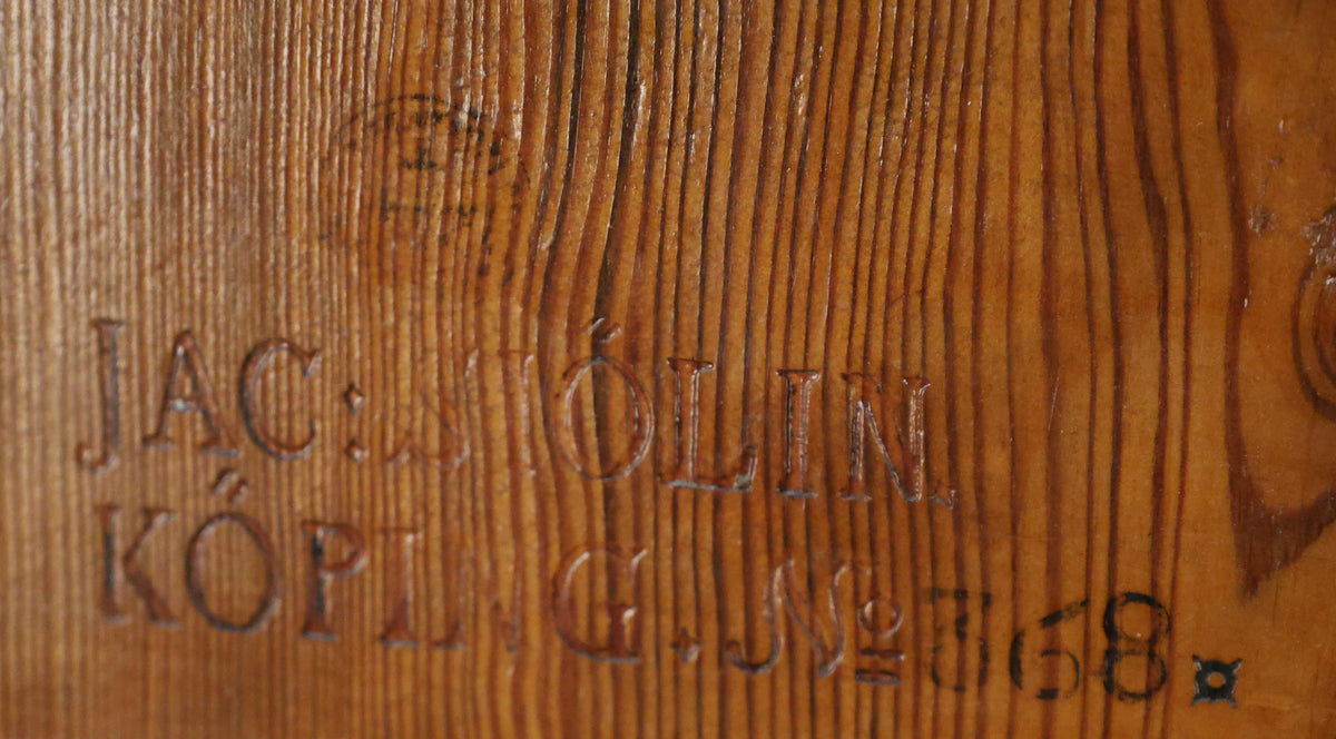The signature of Jacob Sjölin on an antique folding table.