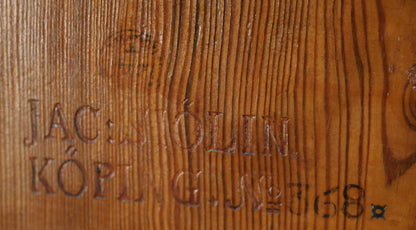 The signature of Jacob Sjölin on an antique folding table.
