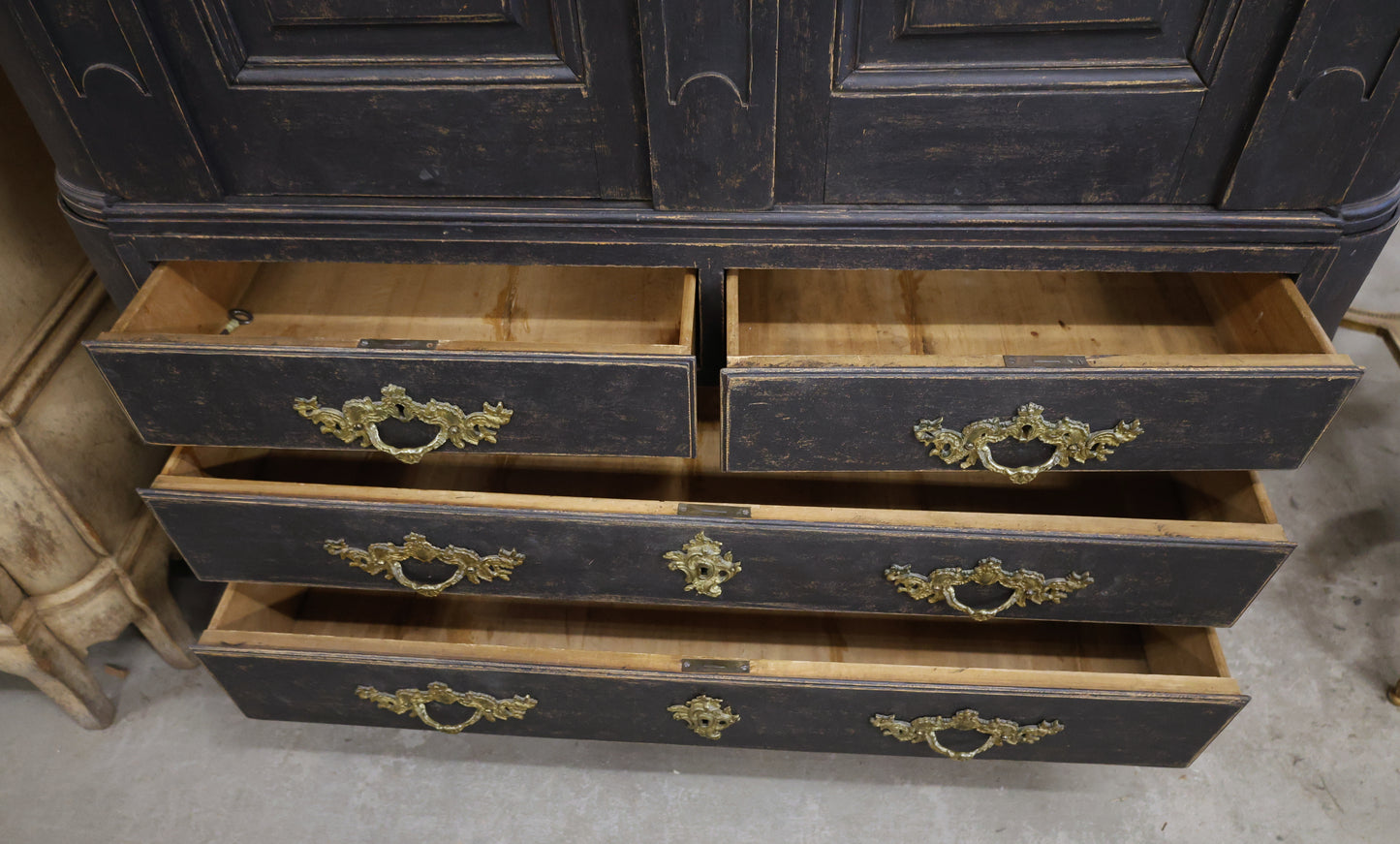 Drawers in an antique cabinet.