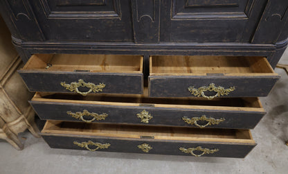 Drawers in an antique cabinet.