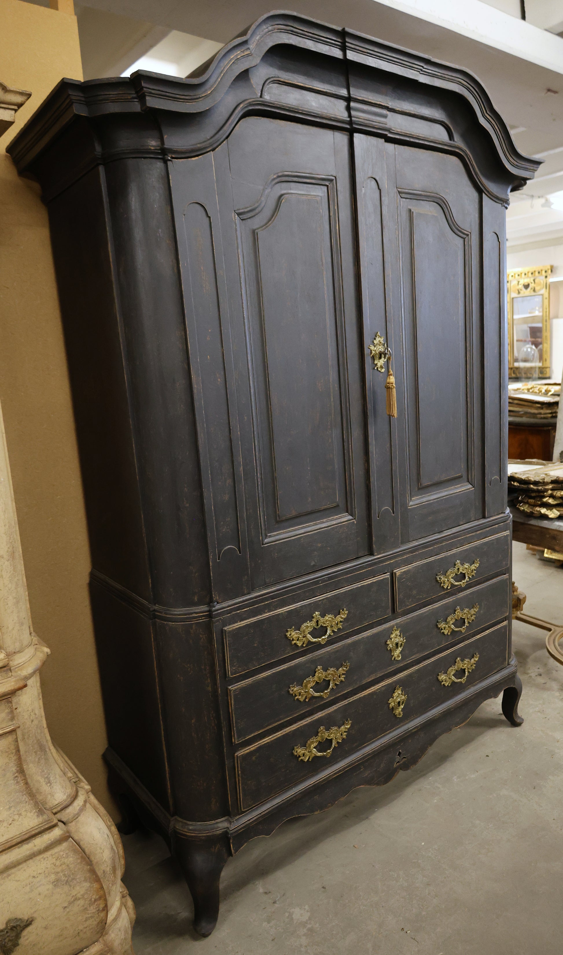 Side view of an antique cabinet.