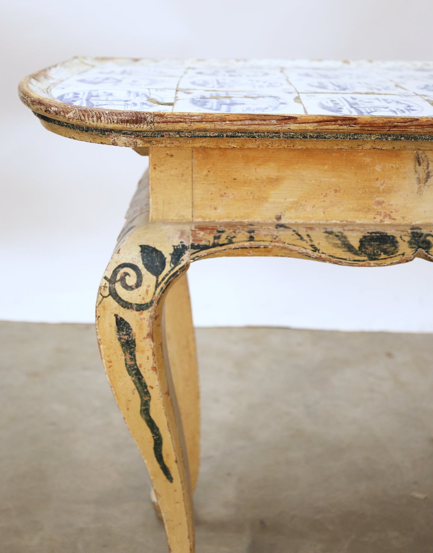 Close up shot of an antique tile table.