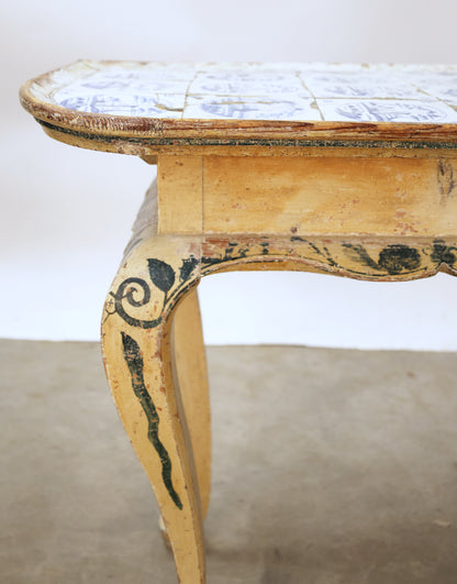 Close up shot of an antique tile table.