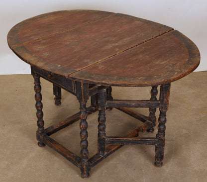 A Baroque gateleg table.