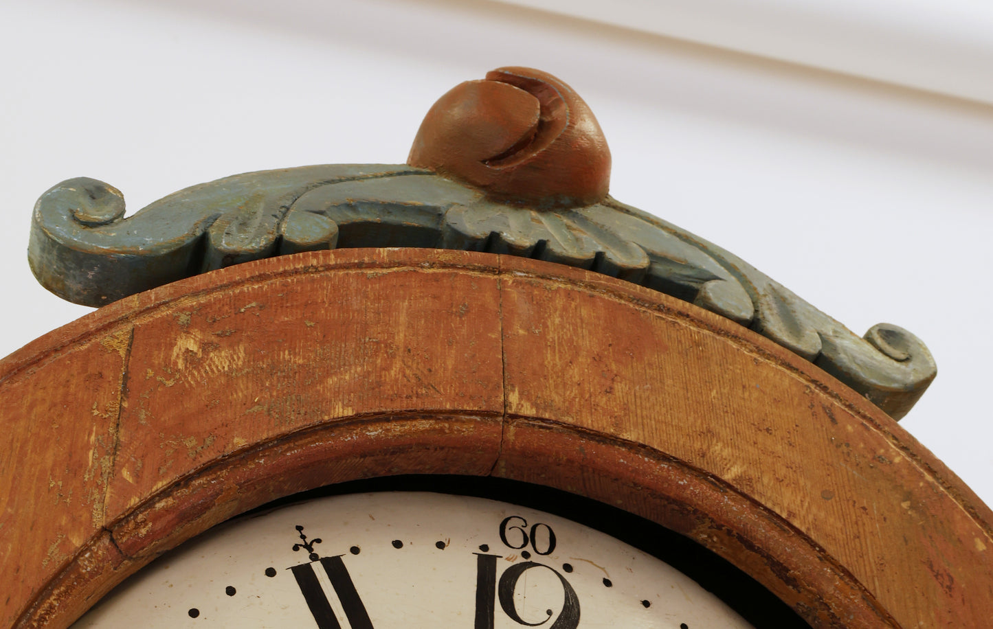 Carved details on an antique longcase clock.