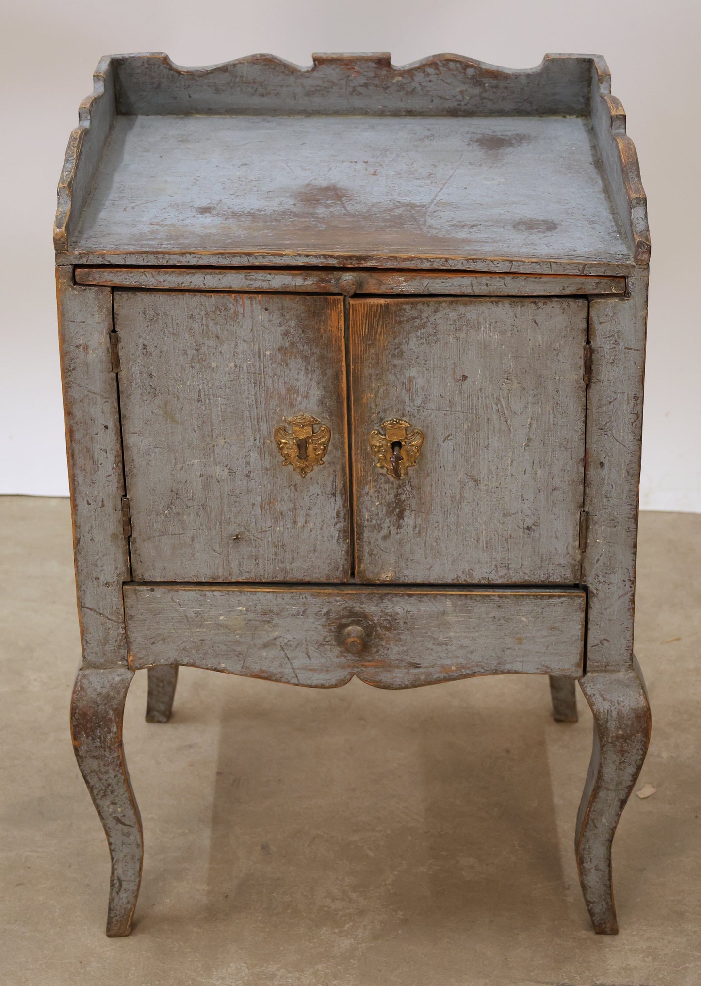 Blue antique Rococo nightstand with gilded fittings.