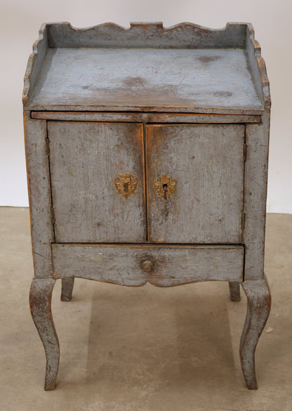 Blue antique Rococo nightstand with gilded fittings.