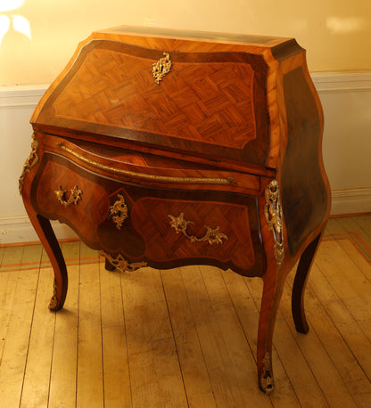 An antique secretary in Rococo.