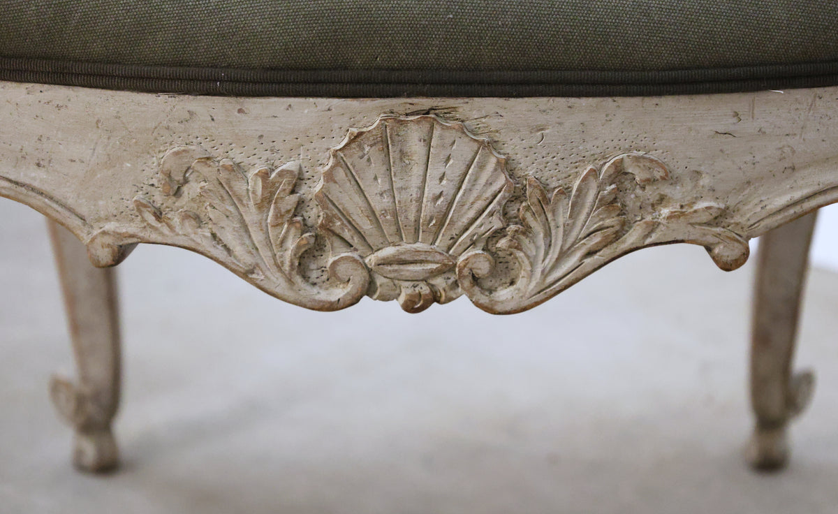 Carved detail on an antique stool.