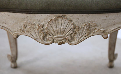 Carved detail on an antique stool.