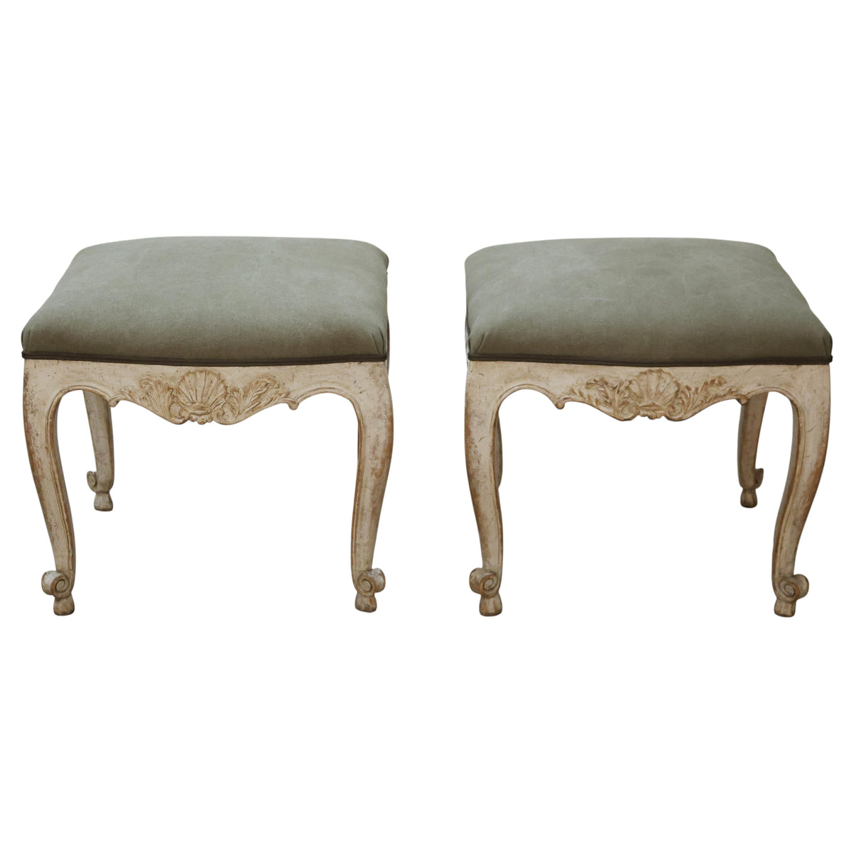 Antique stools with carved details.