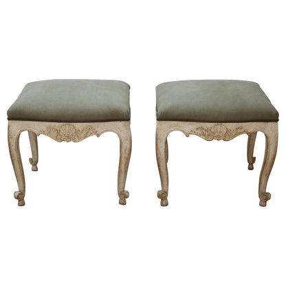 Antique stools with carved details.