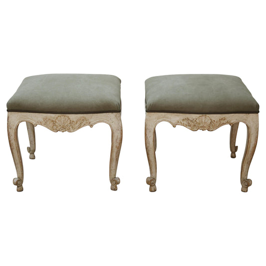 Antique stools with carved details.