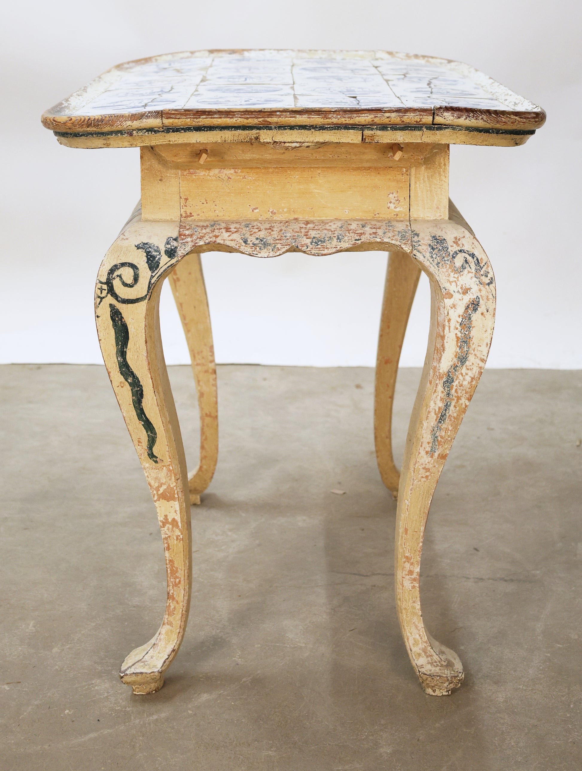Antique tiled table from the side