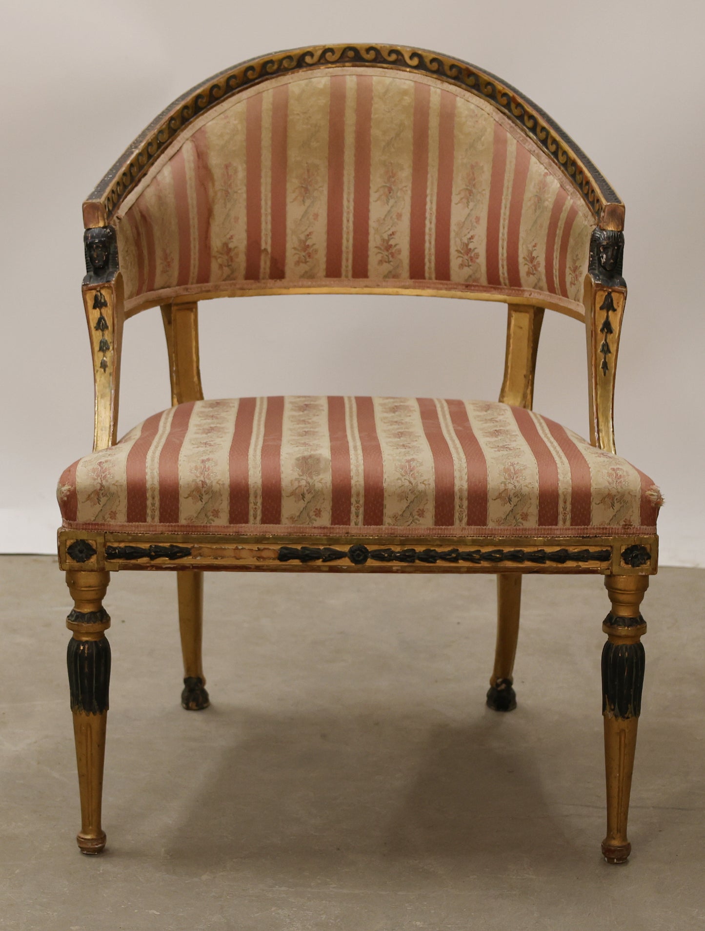 A gilded Gustavian tub chair.
