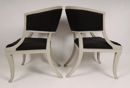 Pair of Early 19th Century Empire Armchairs with their backs against each other 