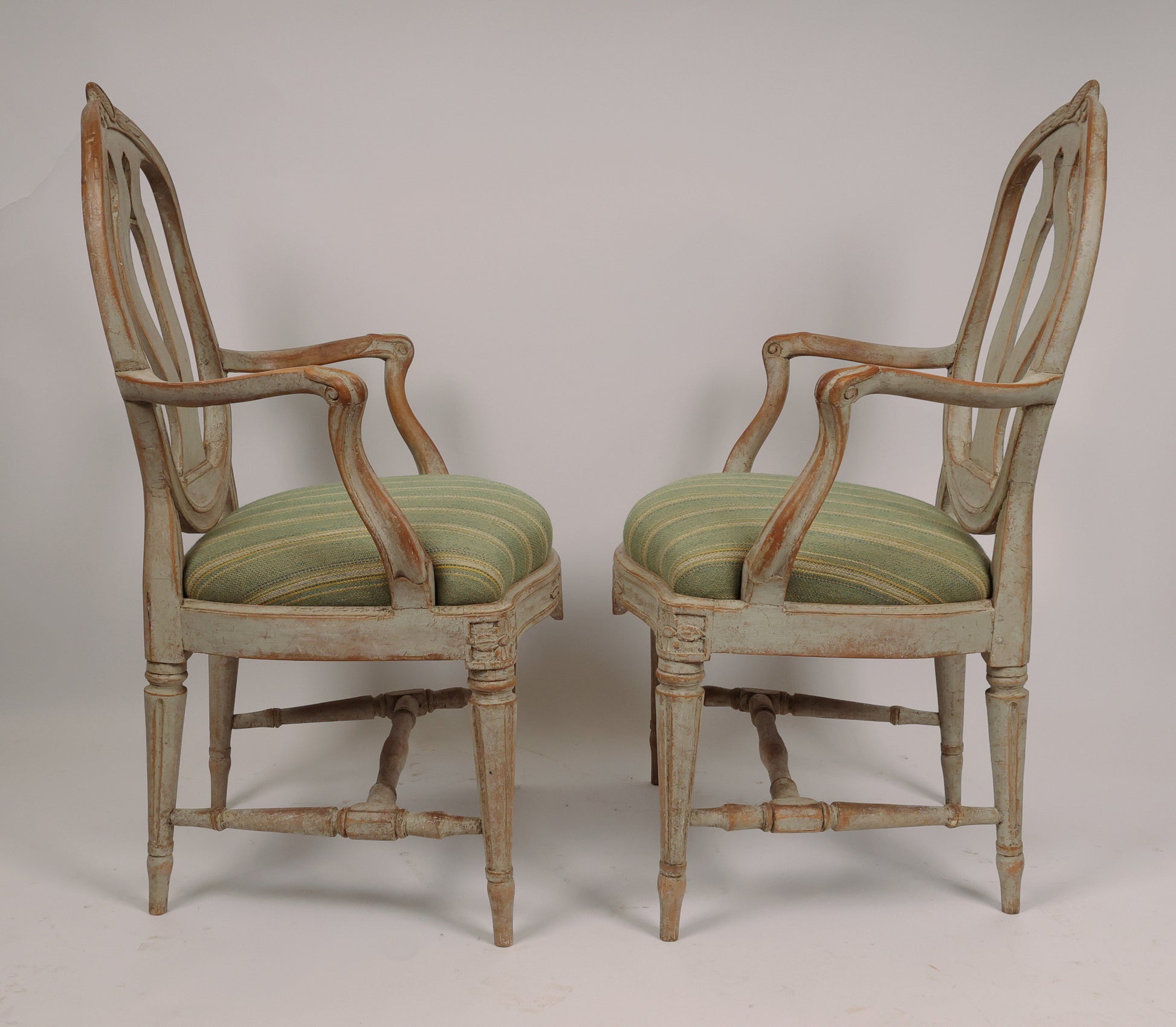 Side view, two chairs facing each other. Titled "18th Century Gustavian Armchairs signed Johan Eric Höglander".