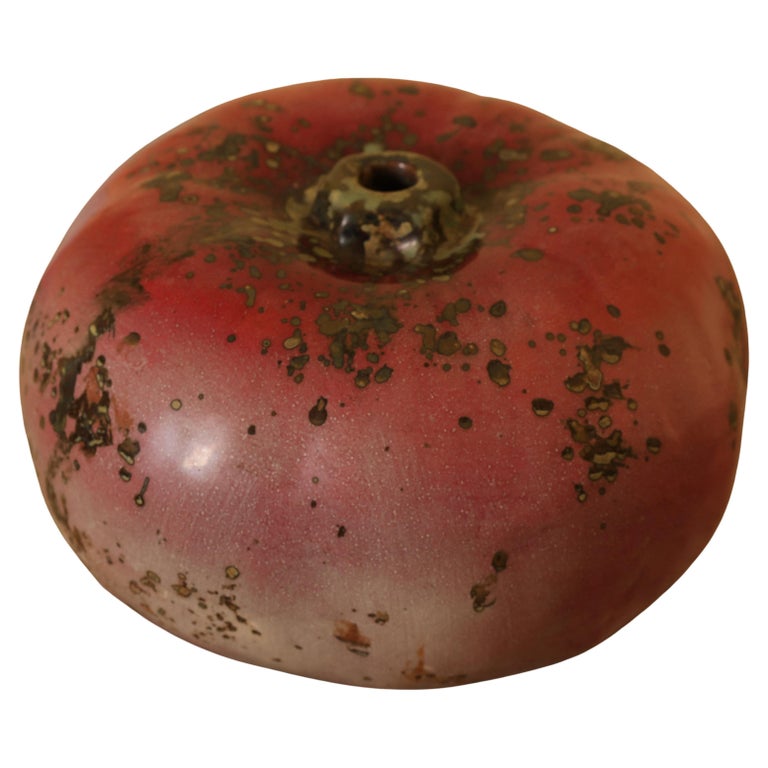 Red high-fired faience pumpkin by Hans Hedberg with white background