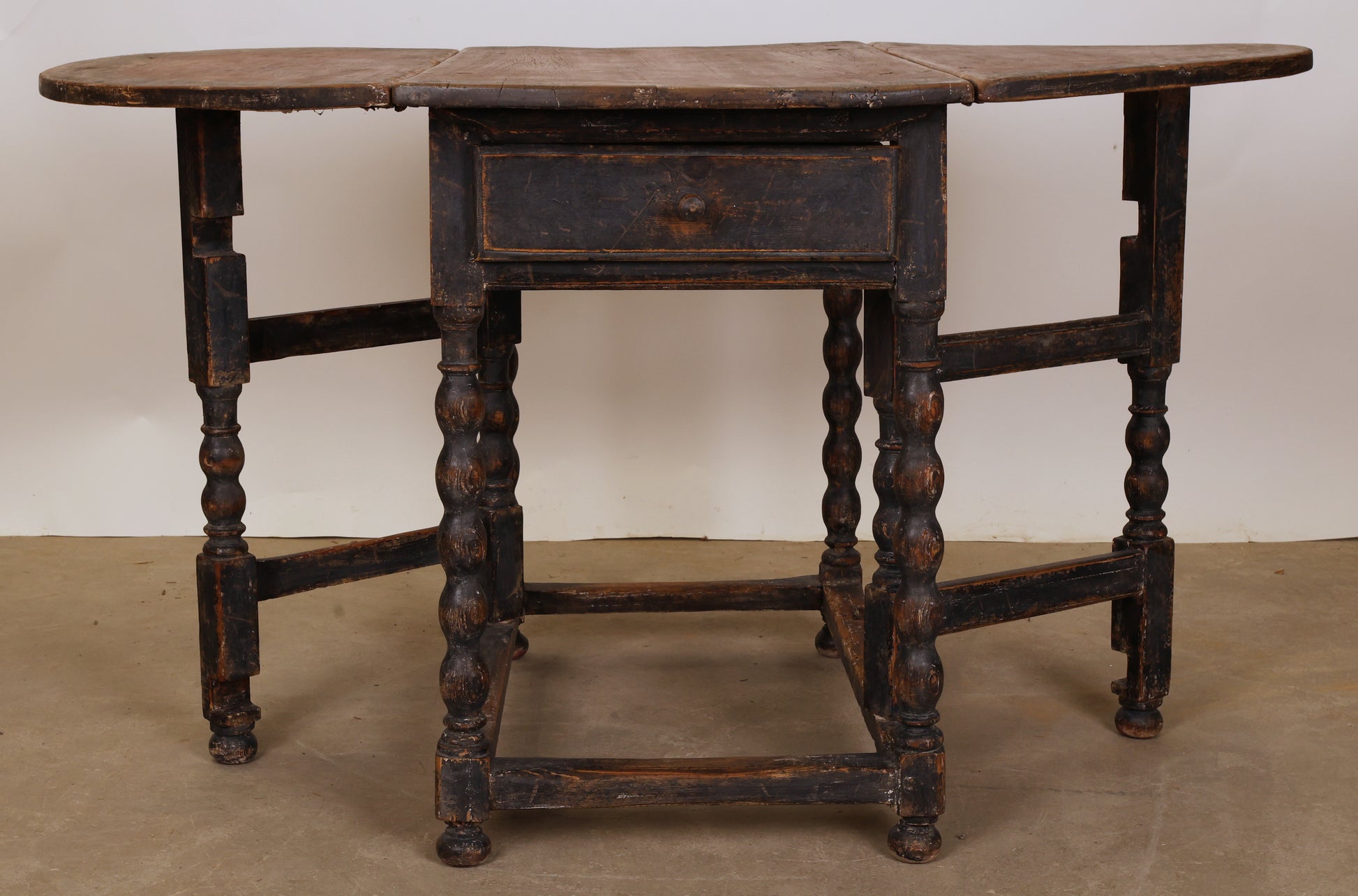 An antique gateleg table from the Baroque epoch.