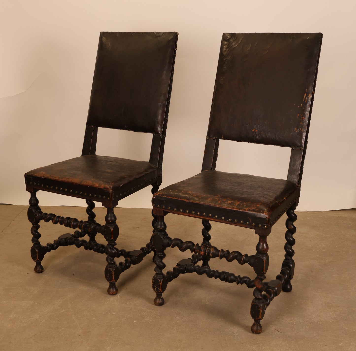 A pair of baroque furniture chairs for sale.