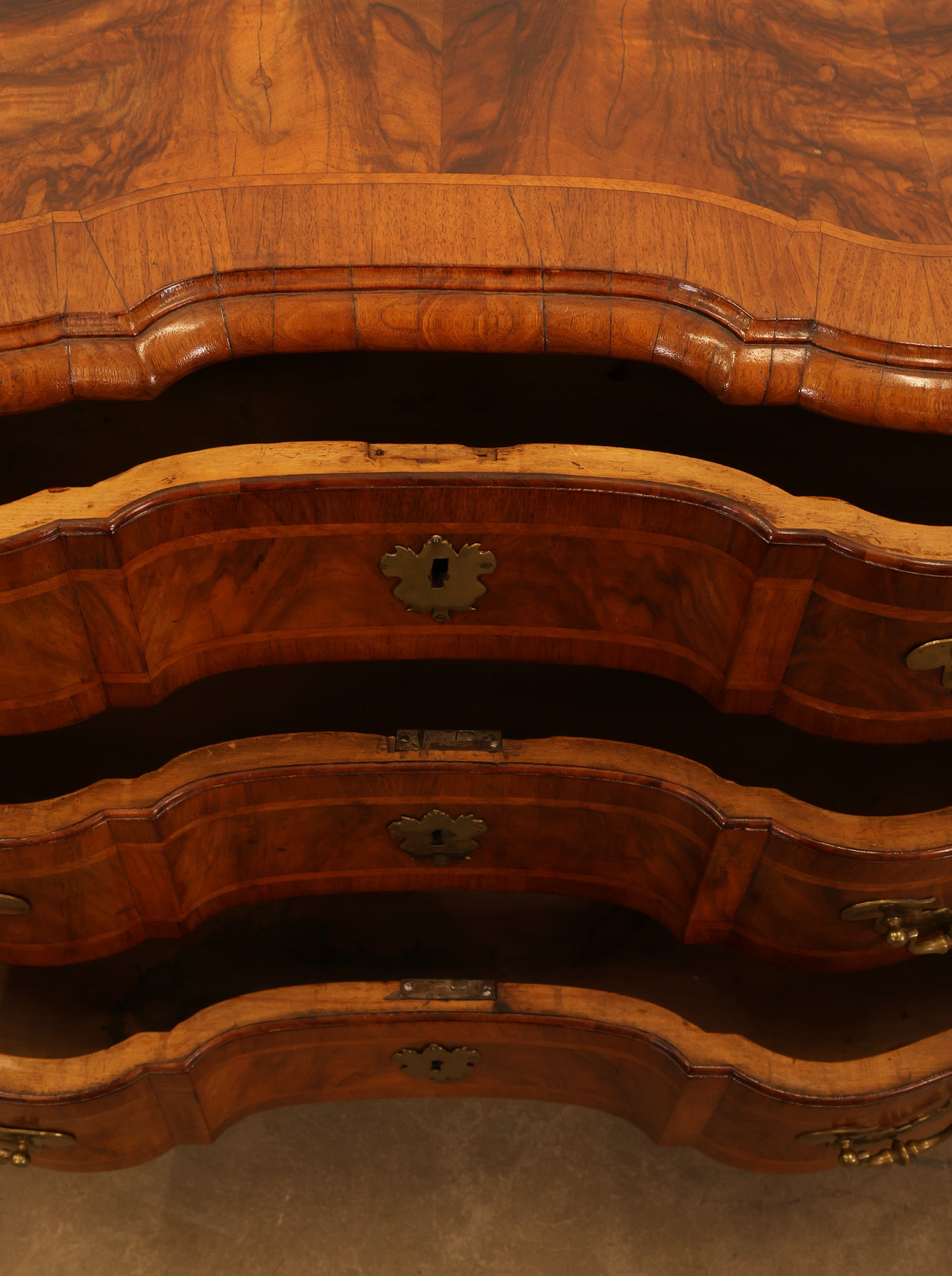 The drawers of a baroque antique dresser.