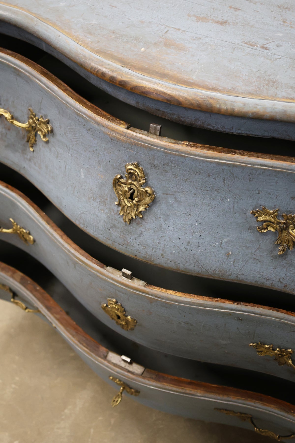 Rococo bureau in a blue colour with gilded fittings
