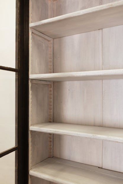 Shelves inside an antique Gustavian cabinet.