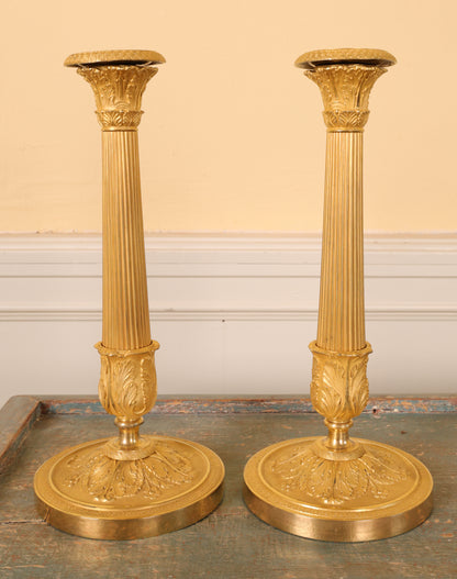 Pair of Empire Candlesticks in burnished gilded bronze