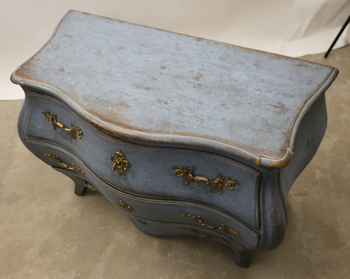 Blue Rococo chest of drawers.