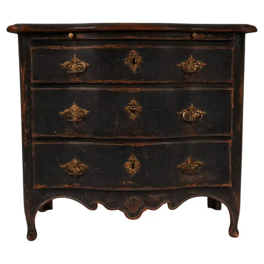 An antique chest of drawers in black color.