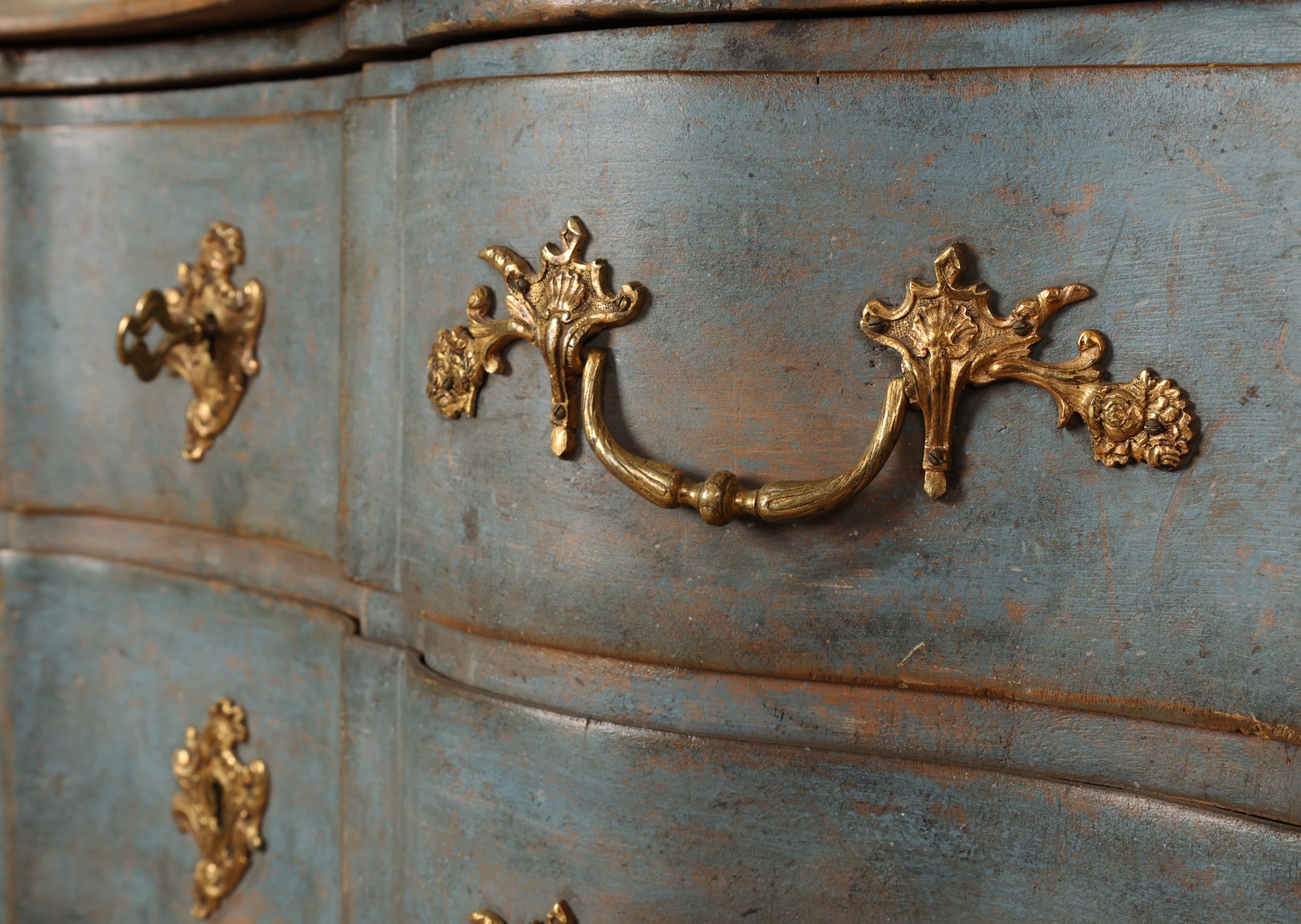 Close up of hardware on a blue 18th Century Baroque Chest of Drawers