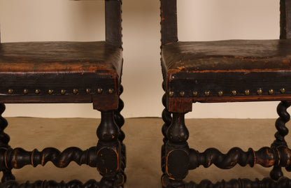 Close up of a pair of Baroque chairs.