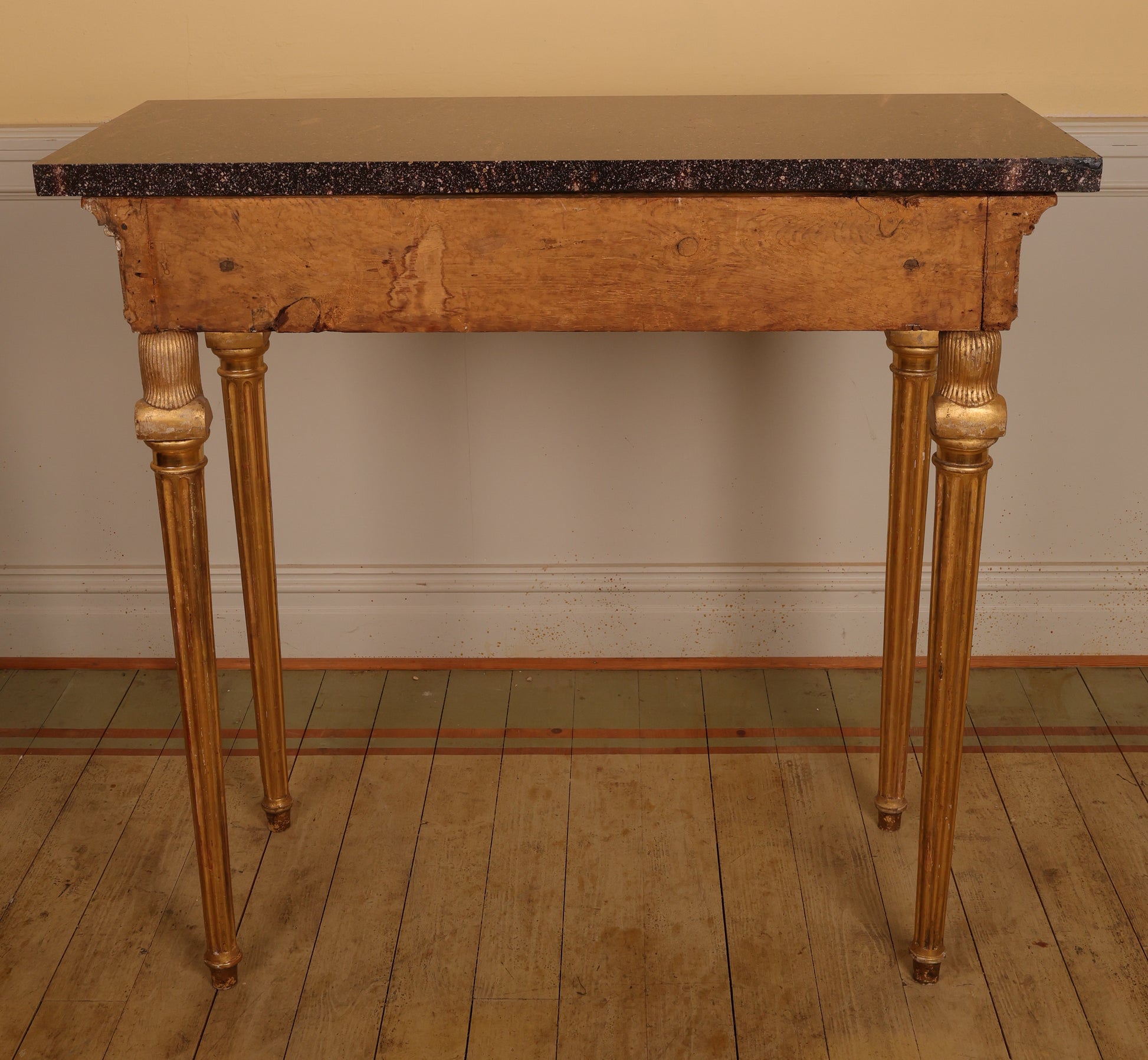 The back of a Gustavian Gilt Console Table with Porphyry Top