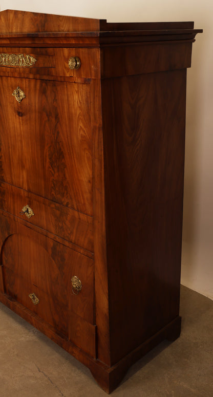 Empire antique furniture. A secretary desk viewed from the side.
