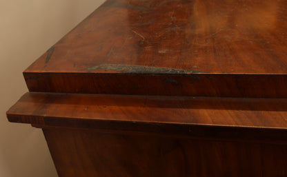 Close-up view of an Empire secretary desk.