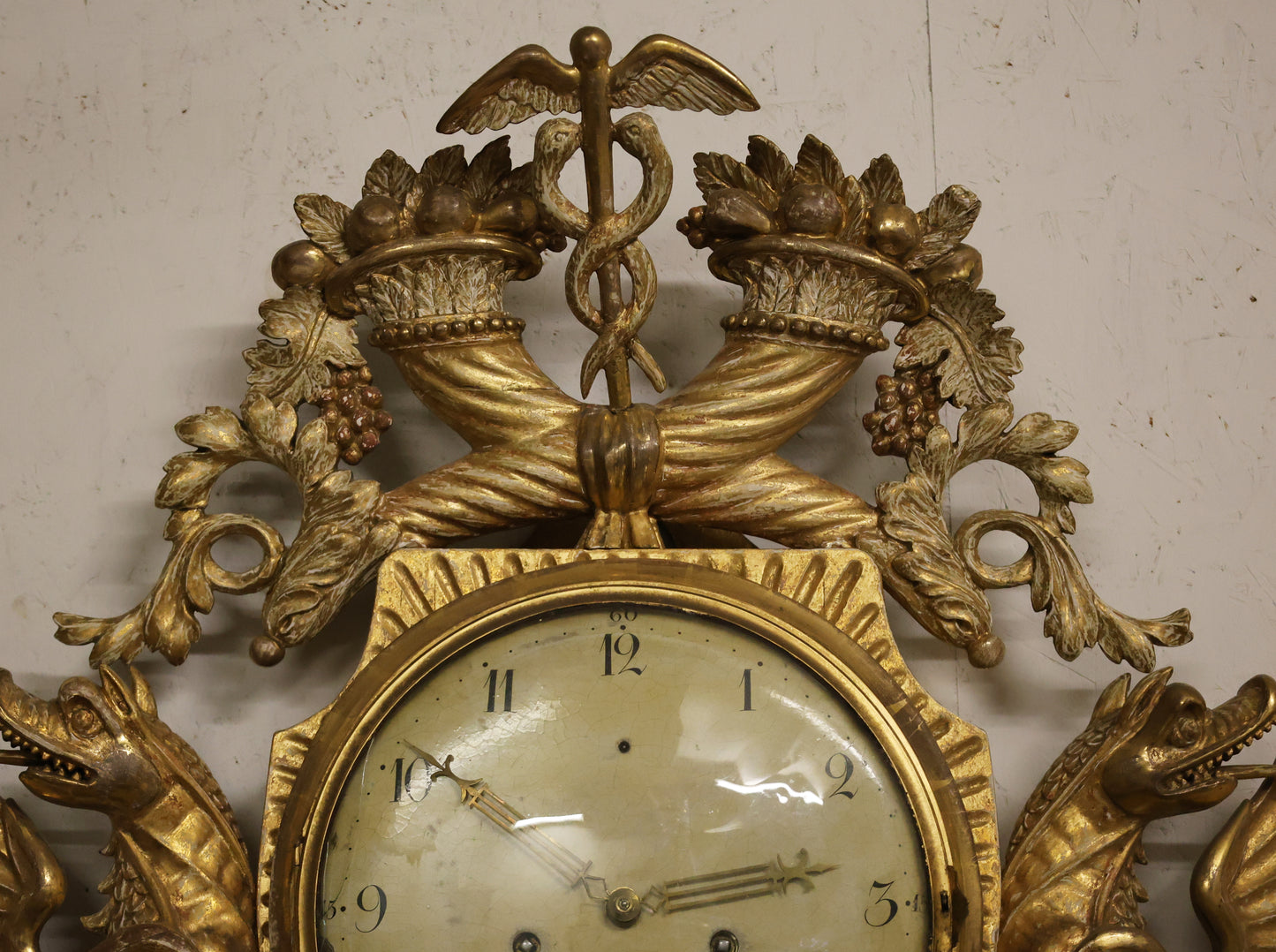 Gilded caduceus on an Empire clock.