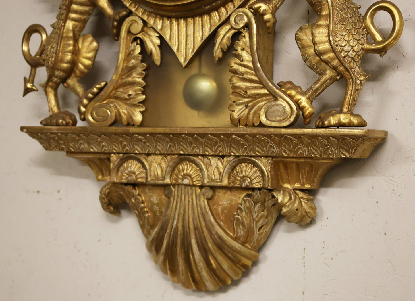 Gilded wall clock from the Empire epoch made by Daniel Norgren.