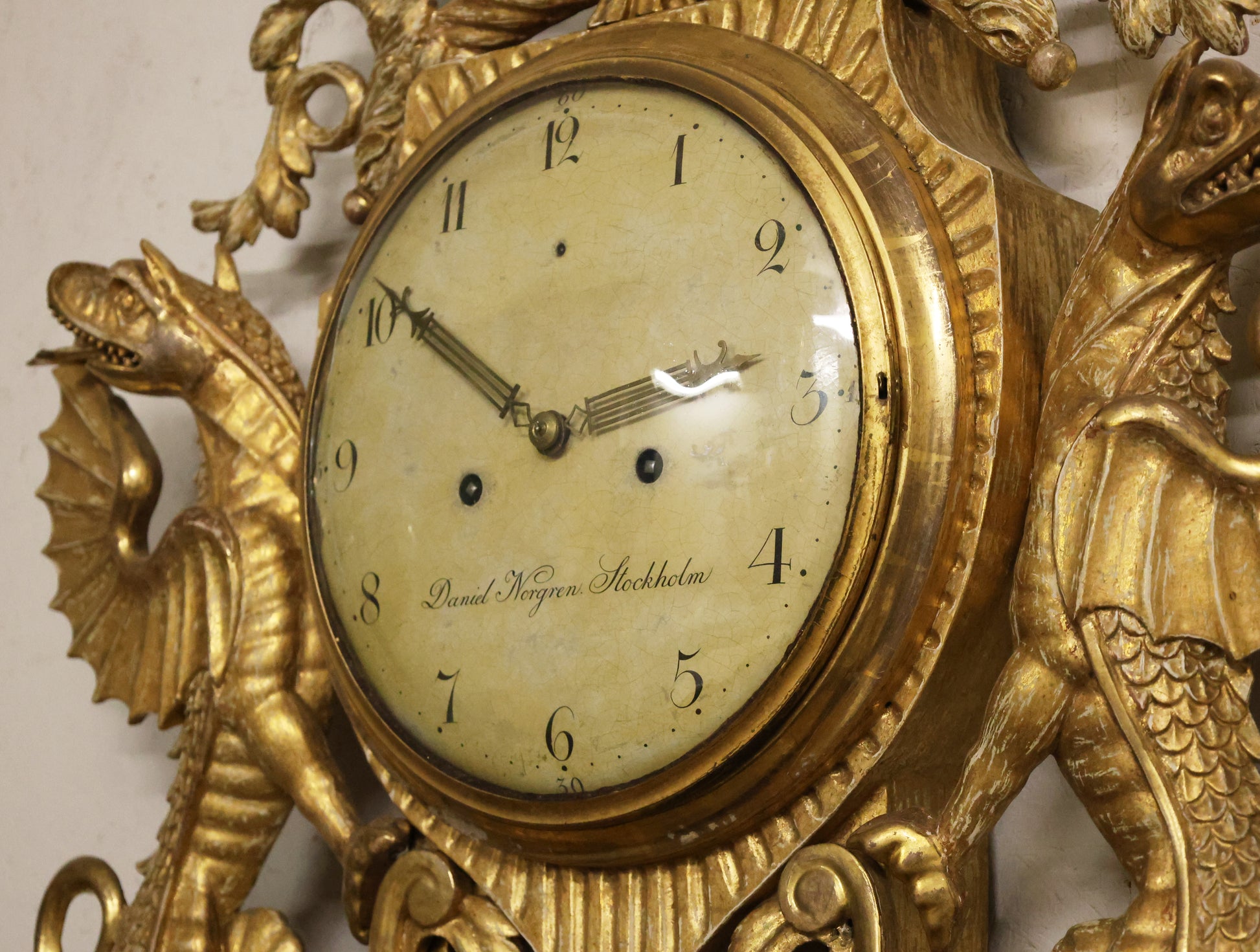 The movement on an Empire wall clock signed by Daniel Norgren.