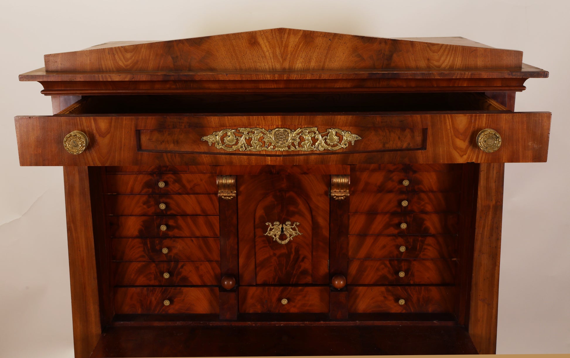 Gilded details on a beautiful antique Empire secretary desk.