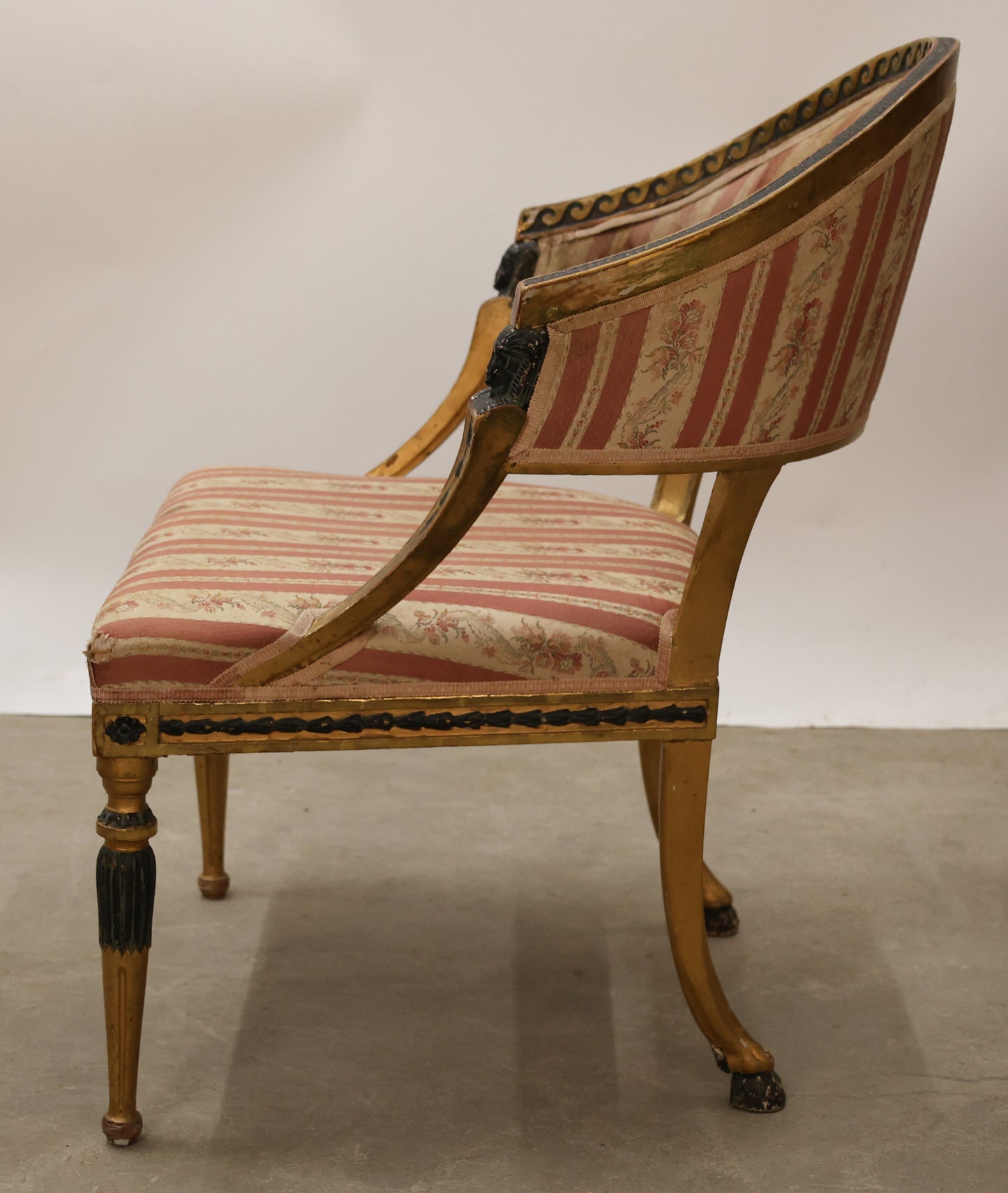 Side view of a Swedish antique tub chair from the Gustavian epoch.